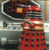 Big red 'Early' Dalek checks out a diagram of the Dalek management structure on Skaro and realises that dominating the universe requires a more obtuse approach...